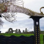 Dragon sculpture above the entrance to the ruins at Newcastle Emlyn